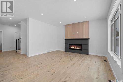 439 Schmeiser Bend, Saskatoon, SK - Indoor Photo Showing Living Room With Fireplace