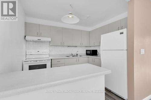 #211 -175 Haig Rd, Belleville, ON - Indoor Photo Showing Kitchen With Double Sink