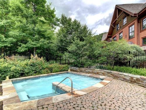 Spa - 7-1520 Ch. Du Versant-Soleil, Mont-Tremblant, QC - Outdoor With In Ground Pool With Backyard