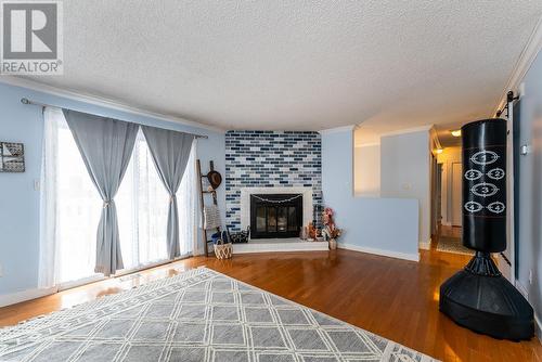 7655 St Patrick Avenue, Prince George, BC - Indoor Photo Showing Living Room With Fireplace