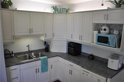 12 1 St Street S, Niverville, MB - Indoor Photo Showing Kitchen With Double Sink