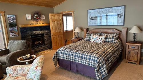 1747 5Th Avenue, Invermere, BC - Indoor Photo Showing Bedroom With Fireplace
