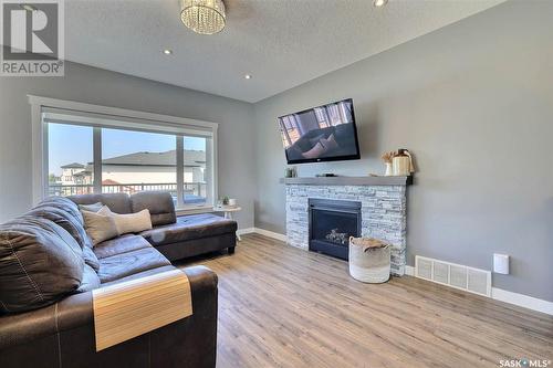 2 Yale Place, White City, SK - Indoor Photo Showing Living Room With Fireplace