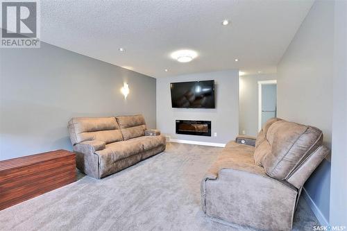 2 Yale Place, White City, SK - Indoor Photo Showing Living Room With Fireplace