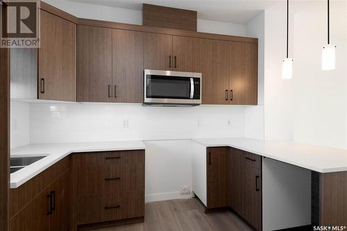7648 Mapleford Boulevard, Regina, SK - Indoor Photo Showing Kitchen With Double Sink