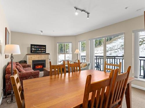 204-1280 Alpine Rd, Courtenay, BC - Indoor Photo Showing Dining Room With Fireplace