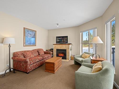 204-1280 Alpine Rd, Courtenay, BC - Indoor Photo Showing Living Room With Fireplace