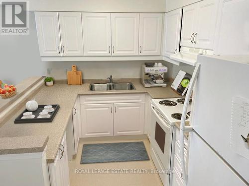 #205 -333 Rue Lafontaine Rd W, Tiny, ON - Indoor Photo Showing Kitchen With Double Sink