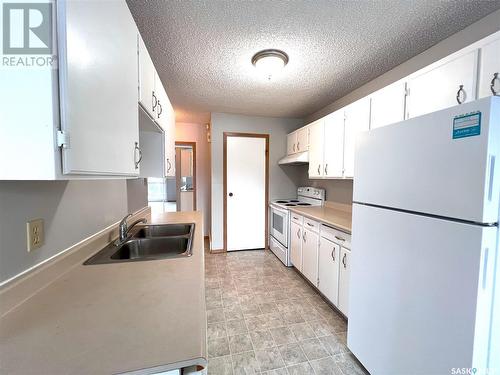 9045 Panton Avenue, North Battleford, SK - Indoor Photo Showing Kitchen With Double Sink
