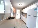 9043 Panton Avenue, North Battleford, SK  - Indoor Photo Showing Kitchen With Double Sink 