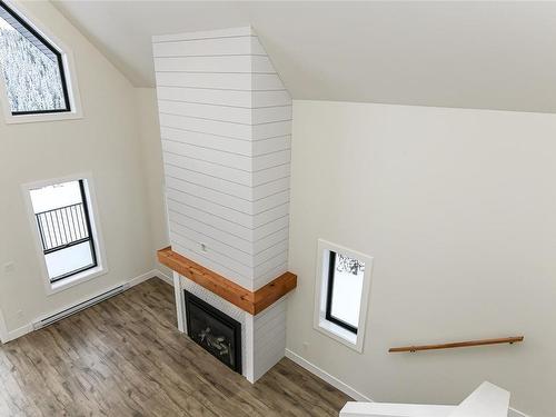 650 Arrowsmith Ridge, Courtenay, BC - Indoor Photo Showing Other Room With Fireplace
