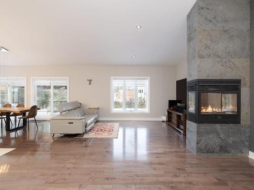 Salon - 89 Rue De L'Oiselet, Saint-Colomban, QC - Indoor Photo Showing Living Room With Fireplace