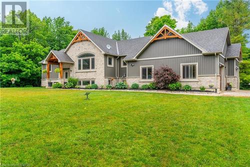 Embrace modern elegance: a stunning bungalow with stone and timber frame, where timeless charm meets contemporary luxury. - 3 Teddy Bear Lane, South Bruce Peninsula, ON - Outdoor With Facade