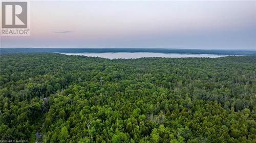 Imagine hiking kilometres of trails on your own property, embarking on all kinds of water adventures, like swimming, boating, and kayaking, even diving right off the dock. - 3 Teddy Bear Lane, South Bruce Peninsula, ON - Outdoor With Body Of Water With View