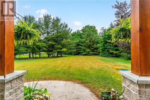 Settle into long views over the expansive lawns from the timber-framed front porch. - 3 Teddy Bear Lane, South Bruce Peninsula, ON - Outdoor