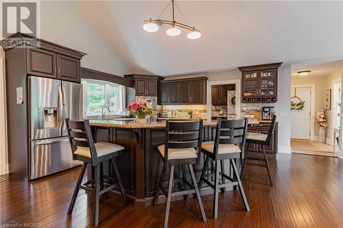 The kitchen is elegant and refined with its Brazilian granite countertops, bespoke mennonite-built cabinetry, stainless steel appliance package, coffee bar, and island with countertop gas range. - 3 Teddy Bear Lane, South Bruce Peninsula, ON - Indoor Photo Showing Dining Room