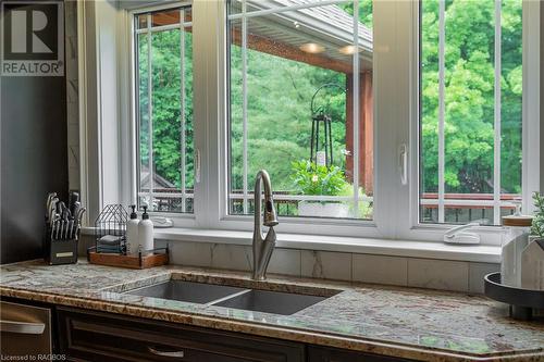 Captivating culinary haven: a luxury kitchen with a view, overlooking the back porch. - 3 Teddy Bear Lane, South Bruce Peninsula, ON - Indoor Photo Showing Kitchen With Double Sink