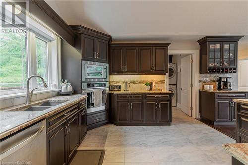 Featuring a coffee bar and built-in wine rack. - 3 Teddy Bear Lane, South Bruce Peninsula, ON - Indoor Photo Showing Kitchen With Double Sink