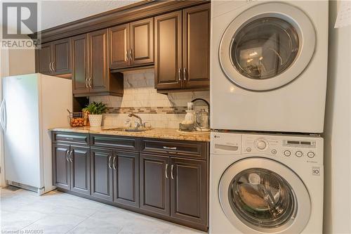 The adjacent butler’s pantry with laundry facilities makes entertaining a breeze, providing the ultimate convenience and functionality for any culinary enthusiast. - 3 Teddy Bear Lane, South Bruce Peninsula, ON - Indoor Photo Showing Laundry Room