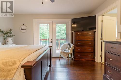 The primary retreat features a luxurious four-piece ensuite and walk-out to the expansive back deck. - 3 Teddy Bear Lane, South Bruce Peninsula, ON - Indoor Photo Showing Bedroom