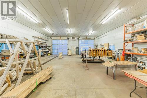 Boasting 3, 12-foot bays, it provides ample space for running a business, indulging in hobbies, or storing prized collections. - 3 Teddy Bear Lane, South Bruce Peninsula, ON - Indoor Photo Showing Garage