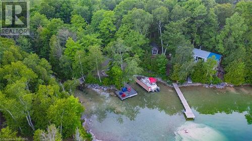 Dock (in middle with red pontoon boat) on Berford Lake accessed via Right of Way. - 3 Teddy Bear Lane, South Bruce Peninsula, ON - Outdoor With Body Of Water With View