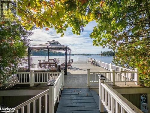 access to upper deck of boat house - 399 Horseshoe Lake, Seguin, ON - Outdoor With Body Of Water With Deck Patio Veranda