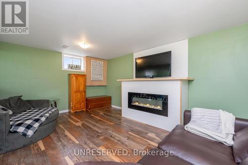 1076 Brussels Line, Howick, ON - Indoor Photo Showing Living Room With Fireplace