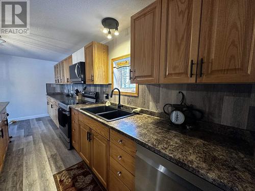 5264 43 Street, Fort Nelson, BC - Indoor Photo Showing Kitchen With Double Sink