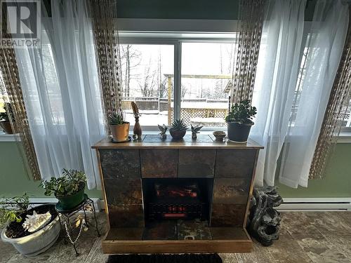5264 43 Street, Fort Nelson, BC - Indoor Photo Showing Other Room With Fireplace