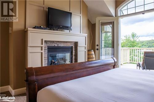 3876 Muskoka Road 118 Unit# Sandfield 2 Week 10, Port Carling, ON - Indoor Photo Showing Bedroom With Fireplace