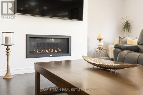 2A Victoria St E, Innisfil, ON - Indoor Photo Showing Living Room With Fireplace