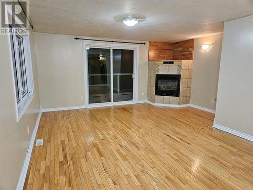 2201 Hillside Road, Chetwynd, BC - Indoor Photo Showing Other Room With Fireplace