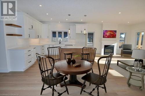 Virtual Staging Dining - 325 6Th Avenue W, Owen Sound, ON - Indoor Photo Showing Dining Room With Fireplace