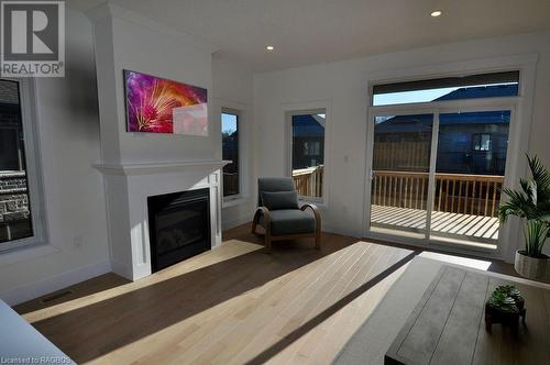 Virtual Staging Living Area - 325 6Th Avenue W, Owen Sound, ON - Indoor Photo Showing Living Room With Fireplace