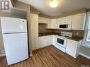 116 4Th Avenue W, Kindersley, SK  - Indoor Photo Showing Kitchen With Double Sink 