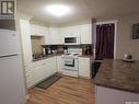 116 4Th Avenue W, Kindersley, SK  - Indoor Photo Showing Kitchen With Double Sink 