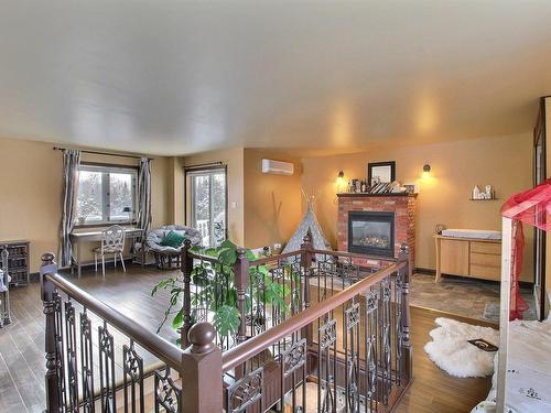 Master bedroom - 122 Ch. Du Pont-Champagne, Val-D'Or, QC - Indoor With Fireplace