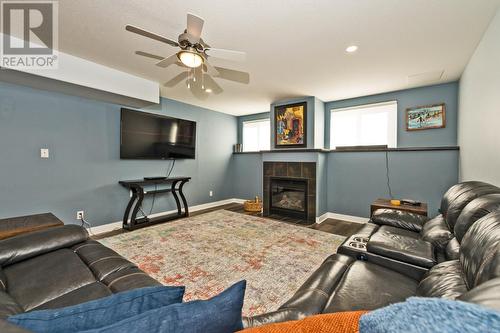 3802 Cypress Hills Drive, Osoyoos, BC - Indoor Photo Showing Living Room With Fireplace