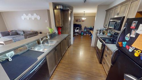 406 - 4874 Stanley Street, Radium Hot Springs, BC - Indoor Photo Showing Kitchen With Double Sink
