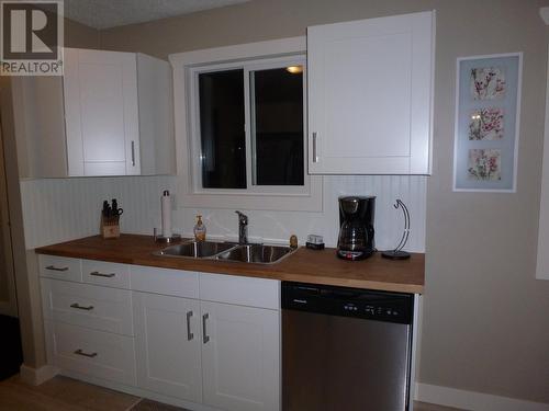 3912 E 53 Avenue, Fort Nelson, BC - Indoor Photo Showing Kitchen With Double Sink
