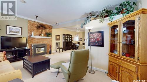 304 2925 14Th Avenue, Regina, SK - Indoor Photo Showing Living Room With Fireplace
