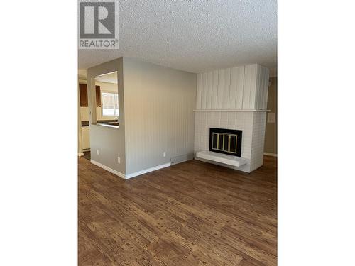 114 Summit Crescent, Mackenzie, BC - Indoor With Fireplace