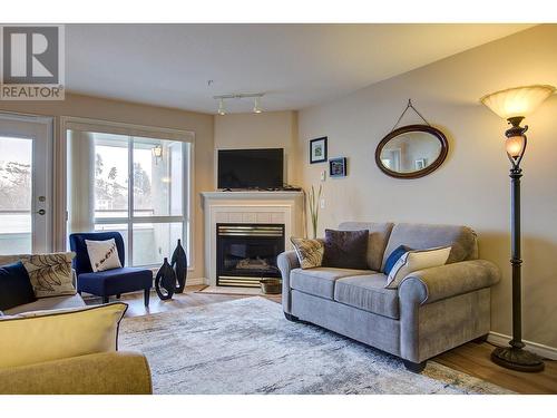 3301 Centennial Drive Unit# 303, Vernon, BC - Indoor Photo Showing Living Room With Fireplace