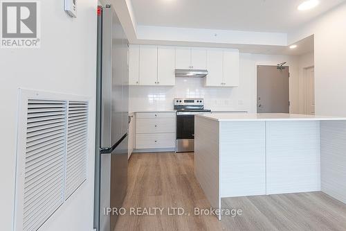 #303 -19B West St N, Kawartha Lakes, ON - Indoor Photo Showing Kitchen With Stainless Steel Kitchen