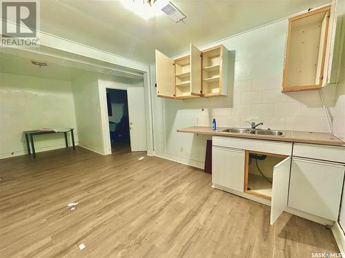 128 S Avenue S, Saskatoon, SK - Indoor Photo Showing Kitchen With Double Sink