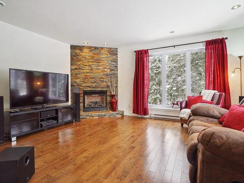 Salon - 216 Rue Du Havre, Saint-Colomban, QC - Indoor Photo Showing Living Room With Fireplace