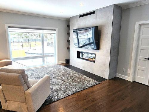 Living room - 16985 Rue Du Zircon, Mirabel, QC - Indoor Photo Showing Other Room With Fireplace