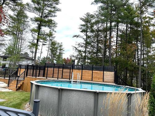 Pool - 16985 Rue Du Zircon, Mirabel, QC - Outdoor With Above Ground Pool With Backyard