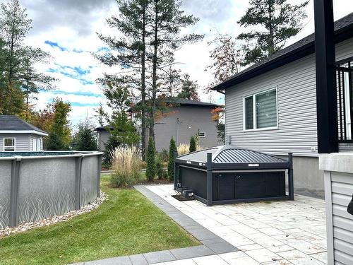 Hot tub - 16985 Rue Du Zircon, Mirabel, QC - Outdoor With Above Ground Pool With Exterior